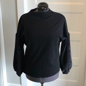 Black top with fur sleeves